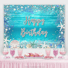 Sous la toile de fond de joyeux anniversaire de coquille de perle de mer