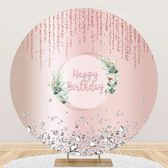 Fond d'anniversaire rond avec des feuilles vertes scintillantes rose clair