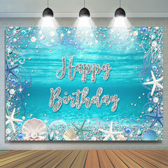 Sous la toile de fond de joyeux anniversaire de coquille de perle de mer